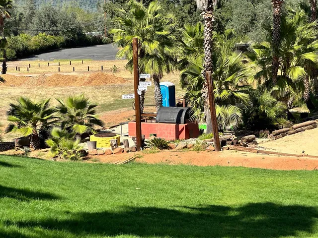 a view of a park with welcome board