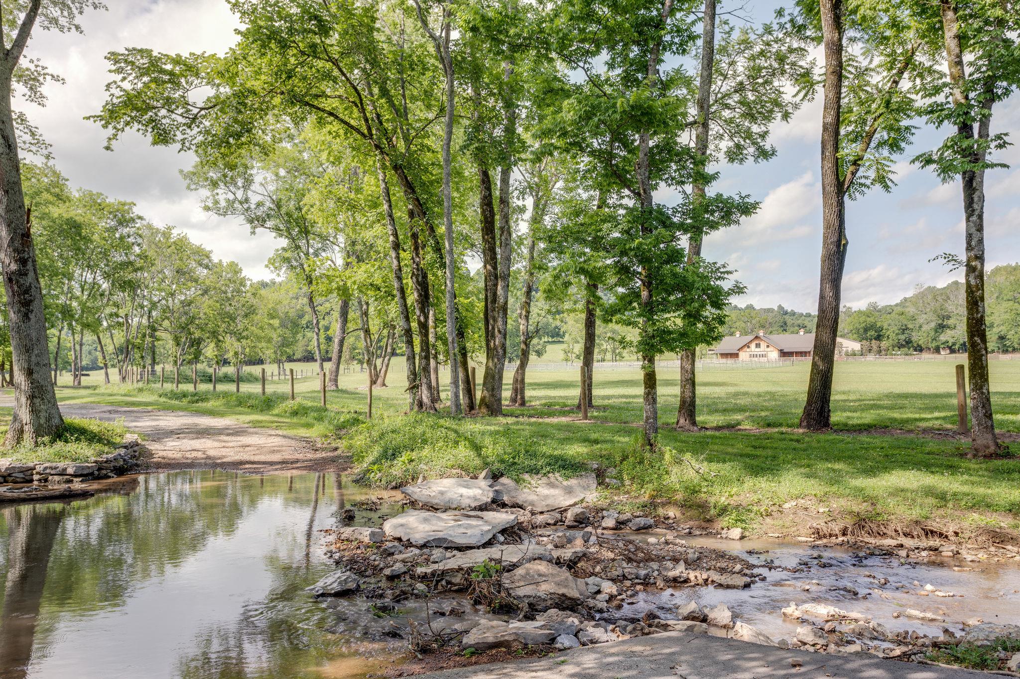 3920 Boston Theta Road Columbia, TN 38401 - Photo 27 of 30 a view of a garden with a lake