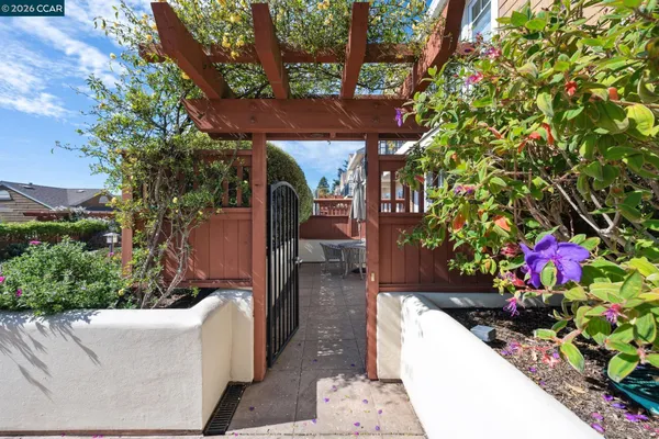a view of a patio with a table and chairs