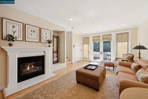 a kitchen with stainless steel appliances granite countertop a refrigerator a sink dishwasher a stove and a refrigerator