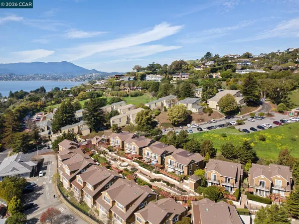 an aerial view of residential houses with outdoor space
