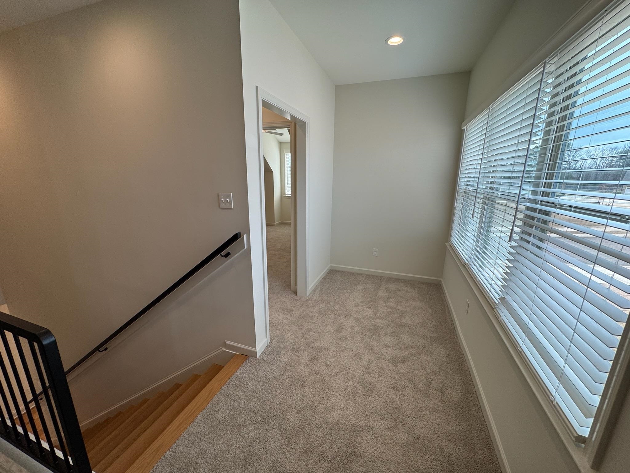11512 Sunsparkler Way Collierville, TN 38017 - Photo 29 of 40 Hall featuring an upstairs landing, light carpet, and recessed lighting