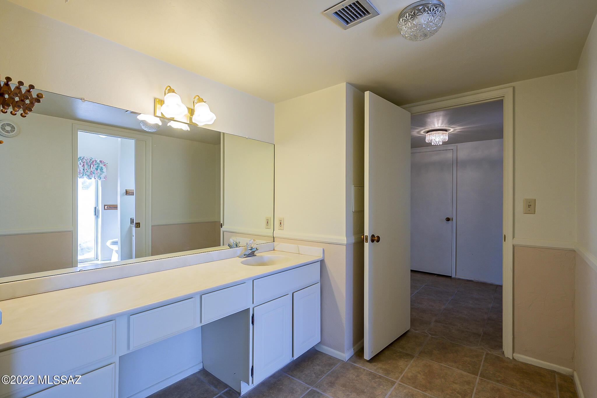 8951 East Bears Path Road Tucson, AZ 85749 - Photo 22 of 41 a bathroom with a double vanity sink shower and a mirror