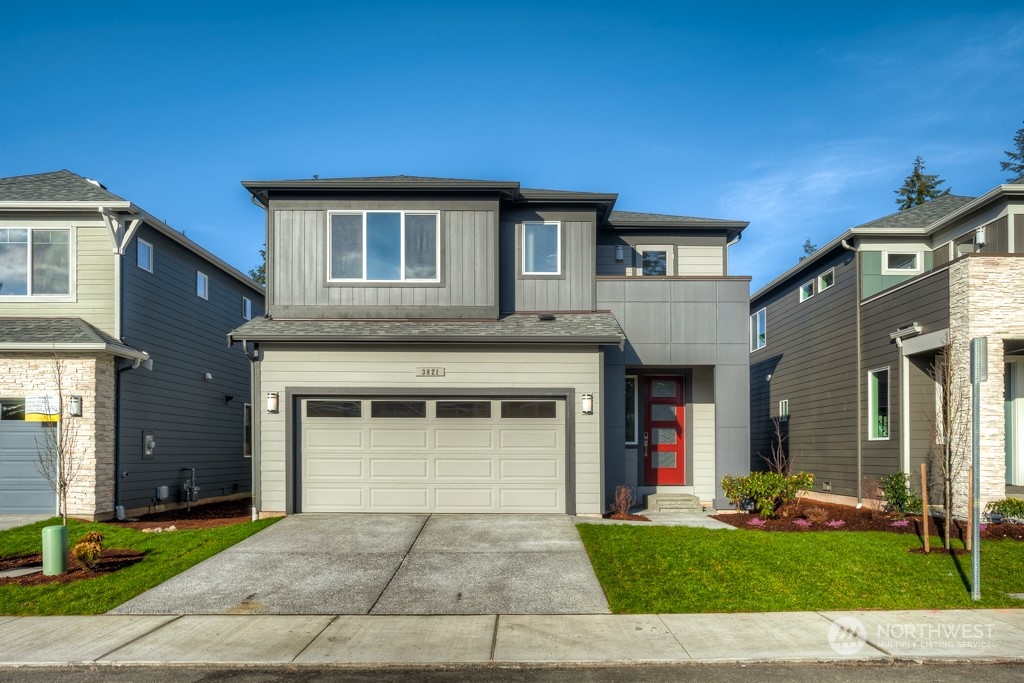 a front view of a house with a yard