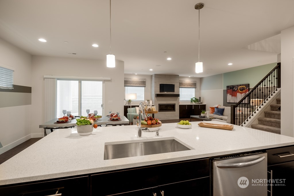 30 177th St S West, Unit IW 81 Bothell, WA 98012 - Photo 12 of 33 a kitchen with a sink appliances and a counter top space