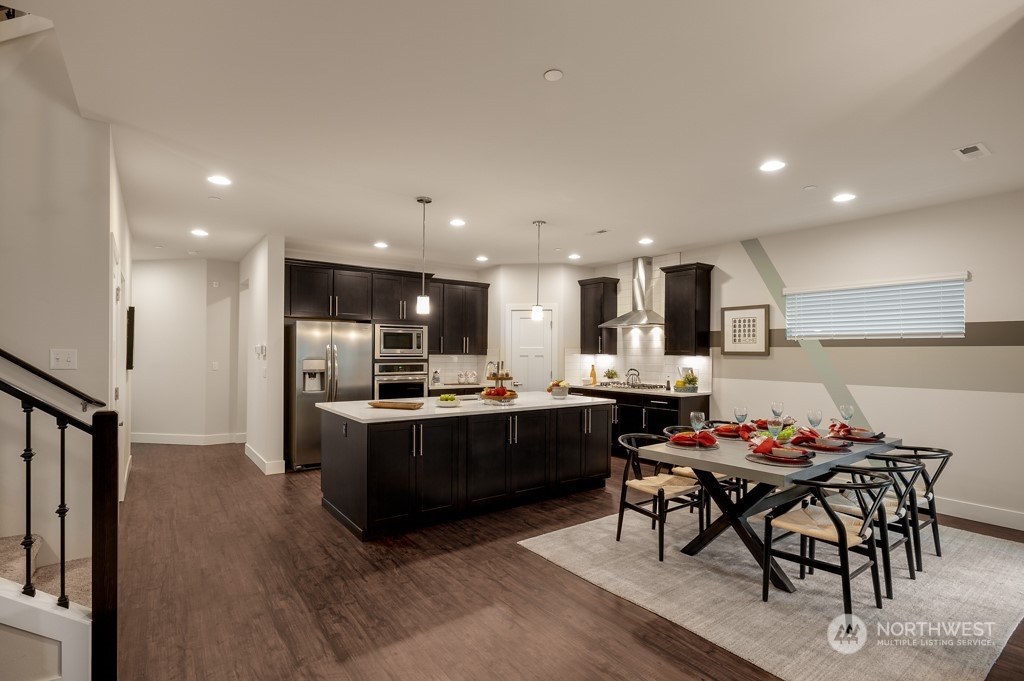 30 177th St S West, Unit IW 81 Bothell, WA 98012 - Photo 14 of 33 a kitchen with a table and chairs in it
