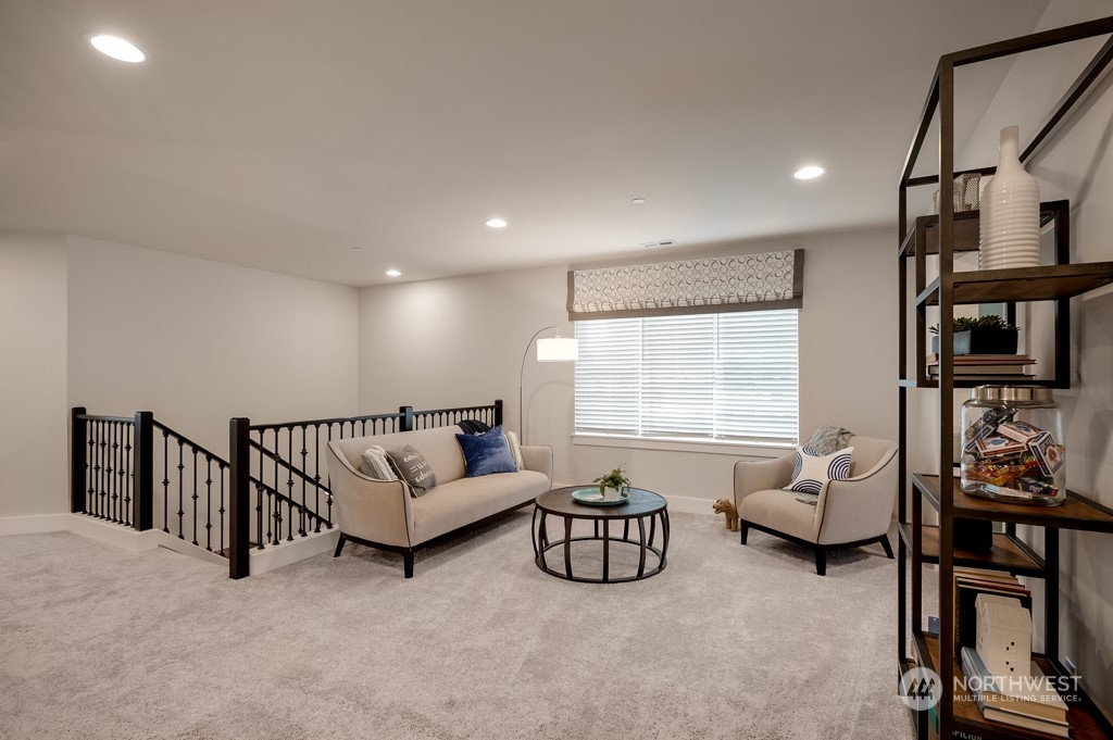 30 177th St S West, Unit IW 81 Bothell, WA 98012 - Photo 16 of 33 a living room with furniture gym equipment and a window