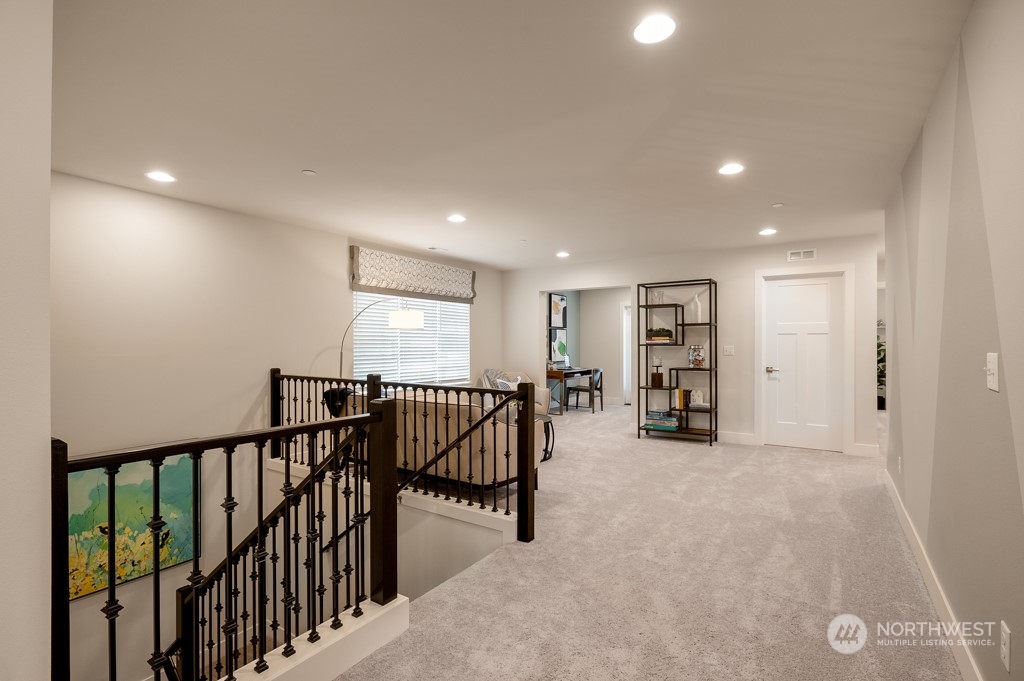 30 177th St S West, Unit IW 81 Bothell, WA 98012 - Photo 17 of 33 a view of a hallway with livingroom and furniture