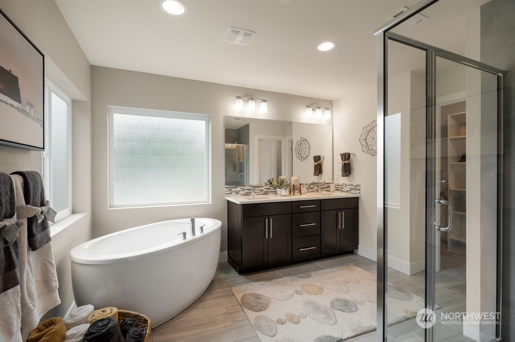 30 177th St S West, Unit IW 81 Bothell, WA 98012 - Photo 20 of 33 a large spacious bathroom with a tub shower and mirror