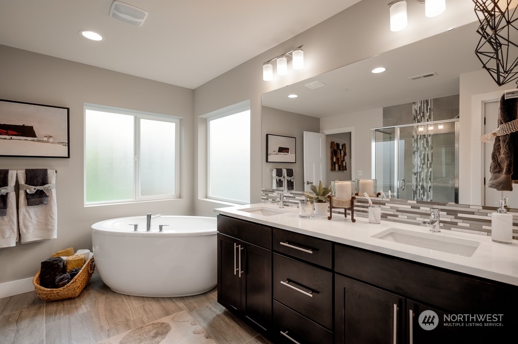 30 177th St S West, Unit IW 81 Bothell, WA 98012 - Photo 21 of 33 a bathroom with a double vanity sink and a bathtub