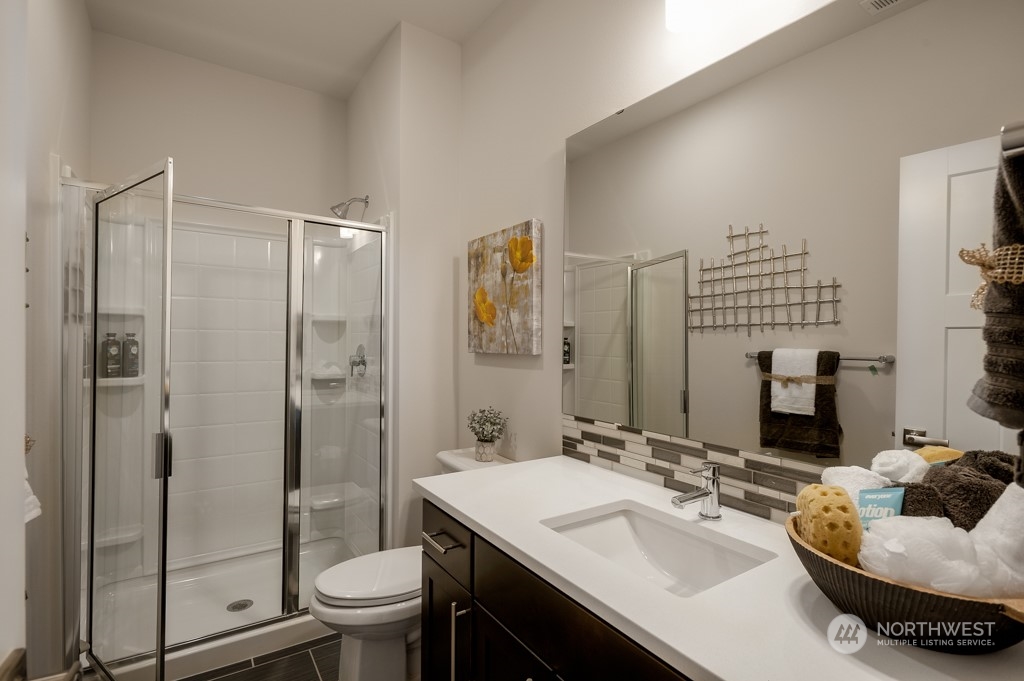 30 177th St S West, Unit IW 81 Bothell, WA 98012 - Photo 5 of 33 a bathroom with a sink toilet and shower