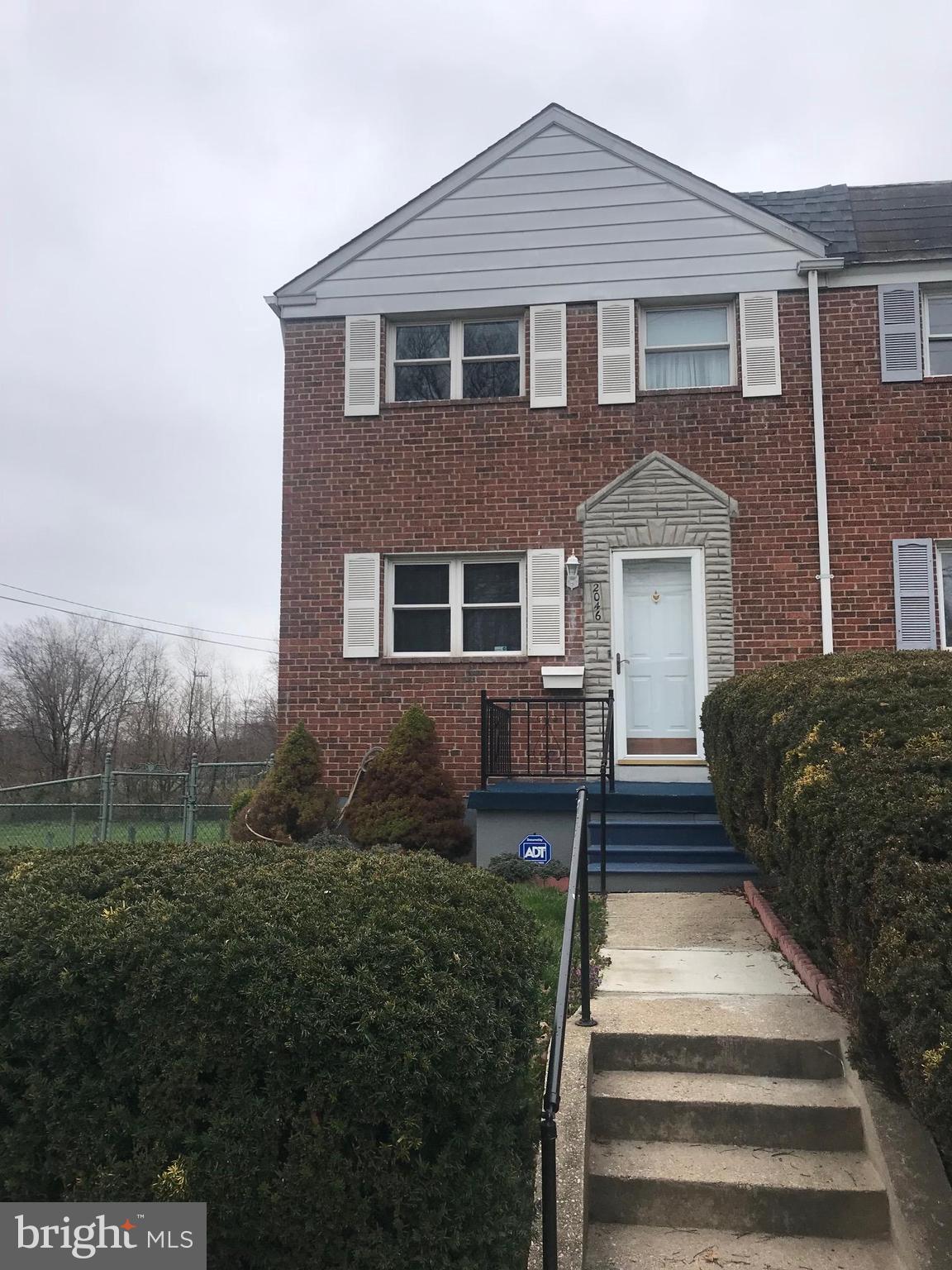2046 Shore Road Baltimore, MD 21222 - Photo 1 of 11 a front view of a house with a yard