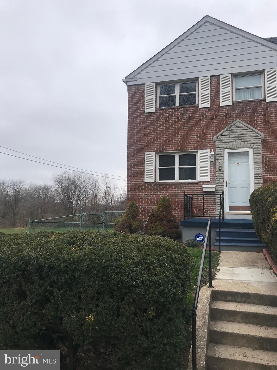 2046 Shore Road Baltimore, MD 21222 - Photo 3 of 11 a front view of a house with a yard
