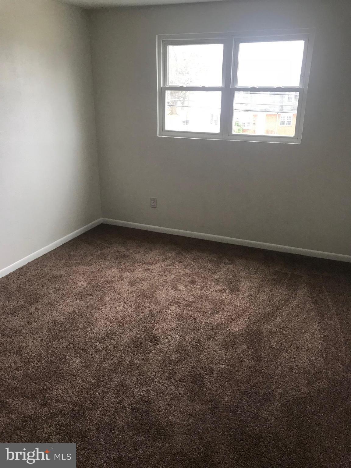 2046 Shore Road Baltimore, MD 21222 - Photo 8 of 11 an empty room with a window