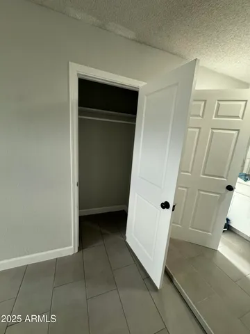 a view of an empty walk in closet