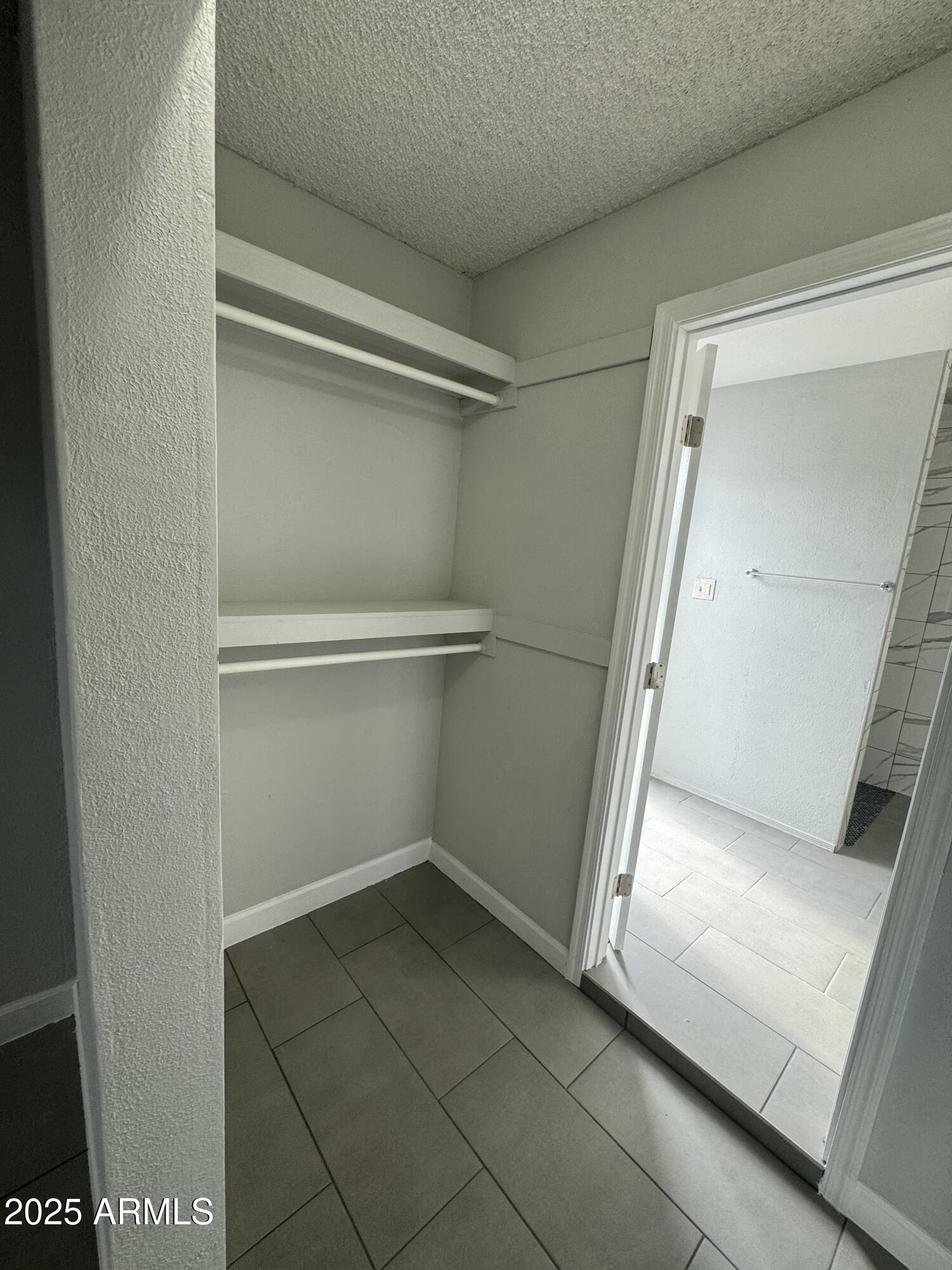13824 North 33rd Drive, Unit 1 Phoenix, AZ 85053 - Photo 7 of 10 a view of an empty walk in closet