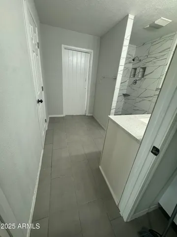 a bathroom with a double vanity sink toilet and a mirror