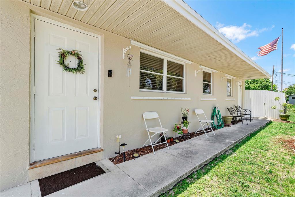 5829 Taylor Street Hollywood, FL 33021 - Photo 4 of 34 a front view of a house with a yard