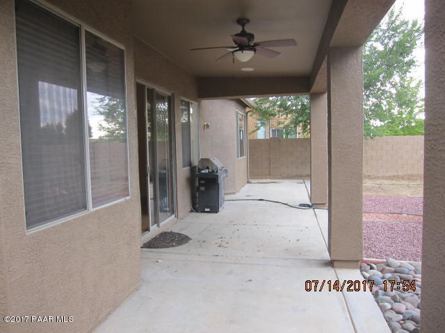 4890 Edgemont Road Prescott Valley, AZ 86314 - Photo 11 of 12 a view of entryway with a floor to ceiling window and a rug