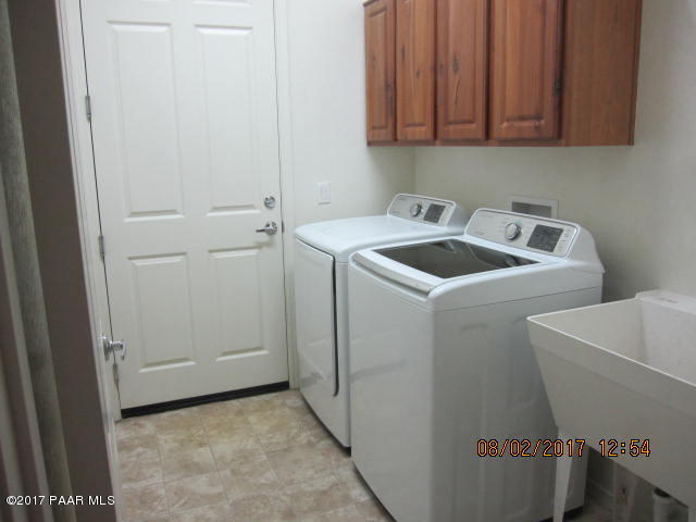 4890 Edgemont Road Prescott Valley, AZ 86314 - Photo 9 of 12 a utility room with dryer and washer