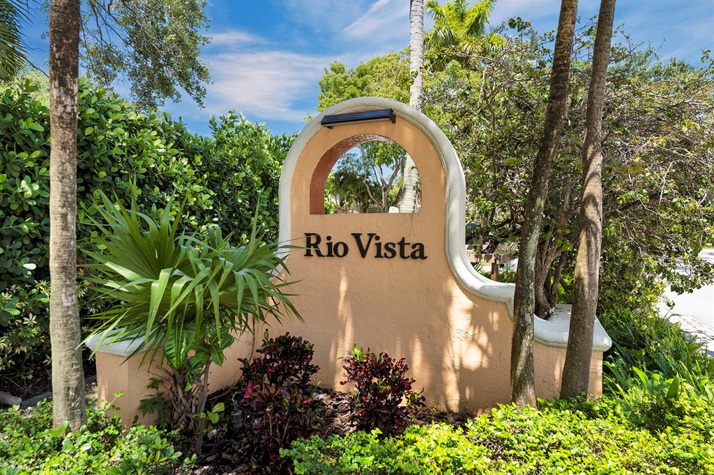 805 Southeast 10th Street Fort Lauderdale, FL 33316 - Photo 2 of 25 a sign that is sitting in front of flowers