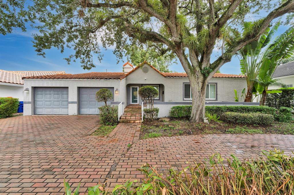 805 Southeast 10th Street Fort Lauderdale, FL 33316 - Photo 6 of 25 a front view of a house with a yard and potted plants