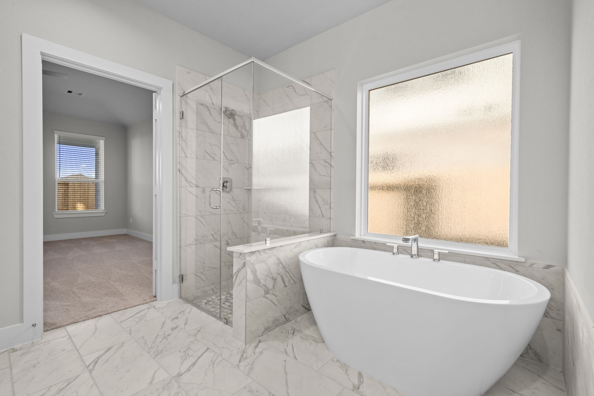 3410 Everglade Lane Rosenberg, TX 77471 - Photo 7 of 16 a white bath tub sitting in a bathroom next to a window