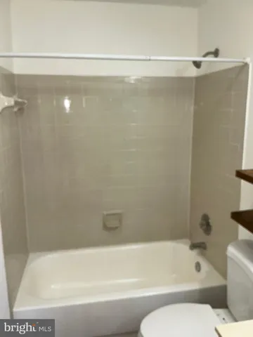 a bathroom with a shower and a bathtub