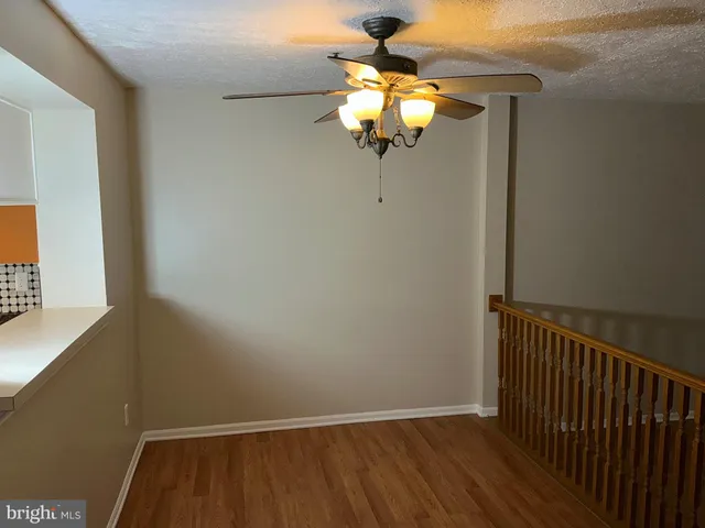 a view of a chandelier fan and window