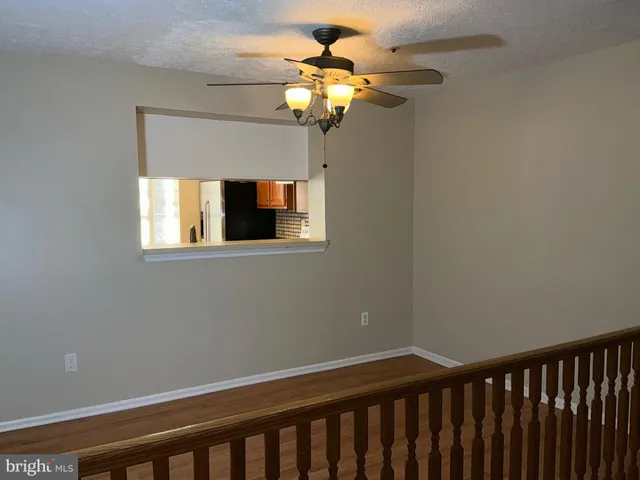 a bathroom with a chandelier and a window