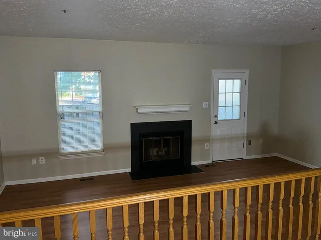 a bedroom with a bed and a fireplace