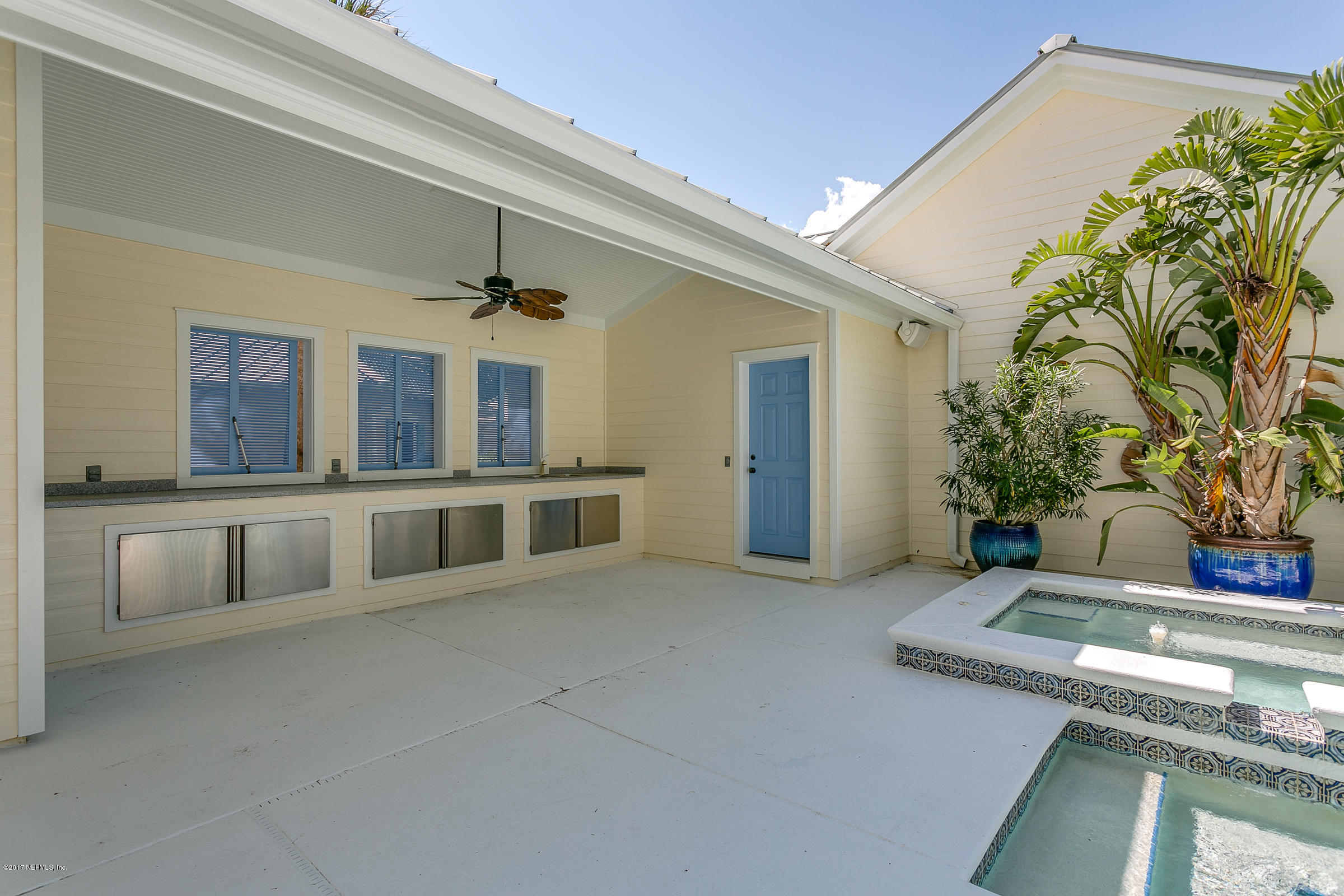 645 Ocean Palm Way St. Augustine, FL 32080 - Photo 17 of 47 a living room with a couch and potted plant