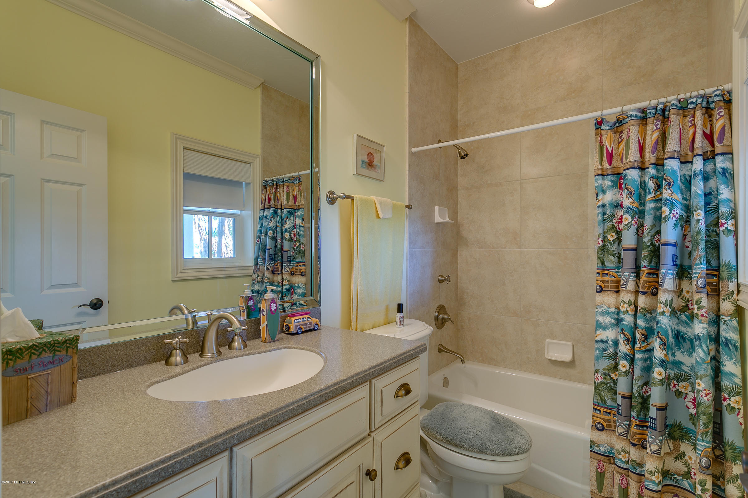 645 Ocean Palm Way St. Augustine, FL 32080 - Photo 19 of 47 a bathroom with a sink a toilet and shower