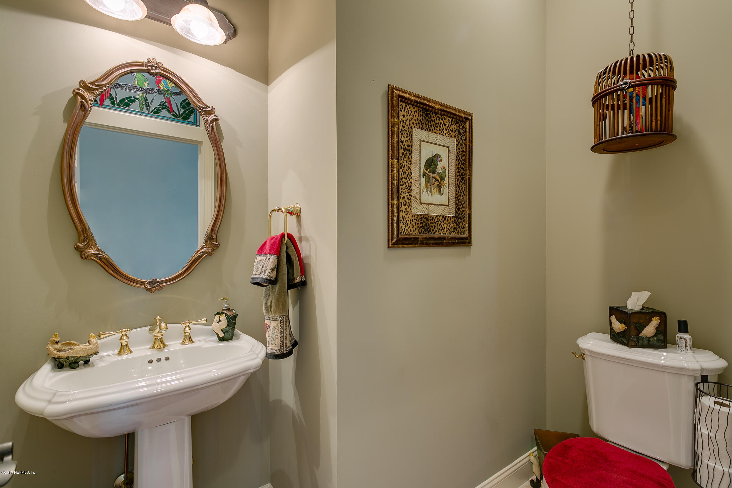 645 Ocean Palm Way St. Augustine, FL 32080 - Photo 20 of 47 a bathroom with a sink and a mirror
