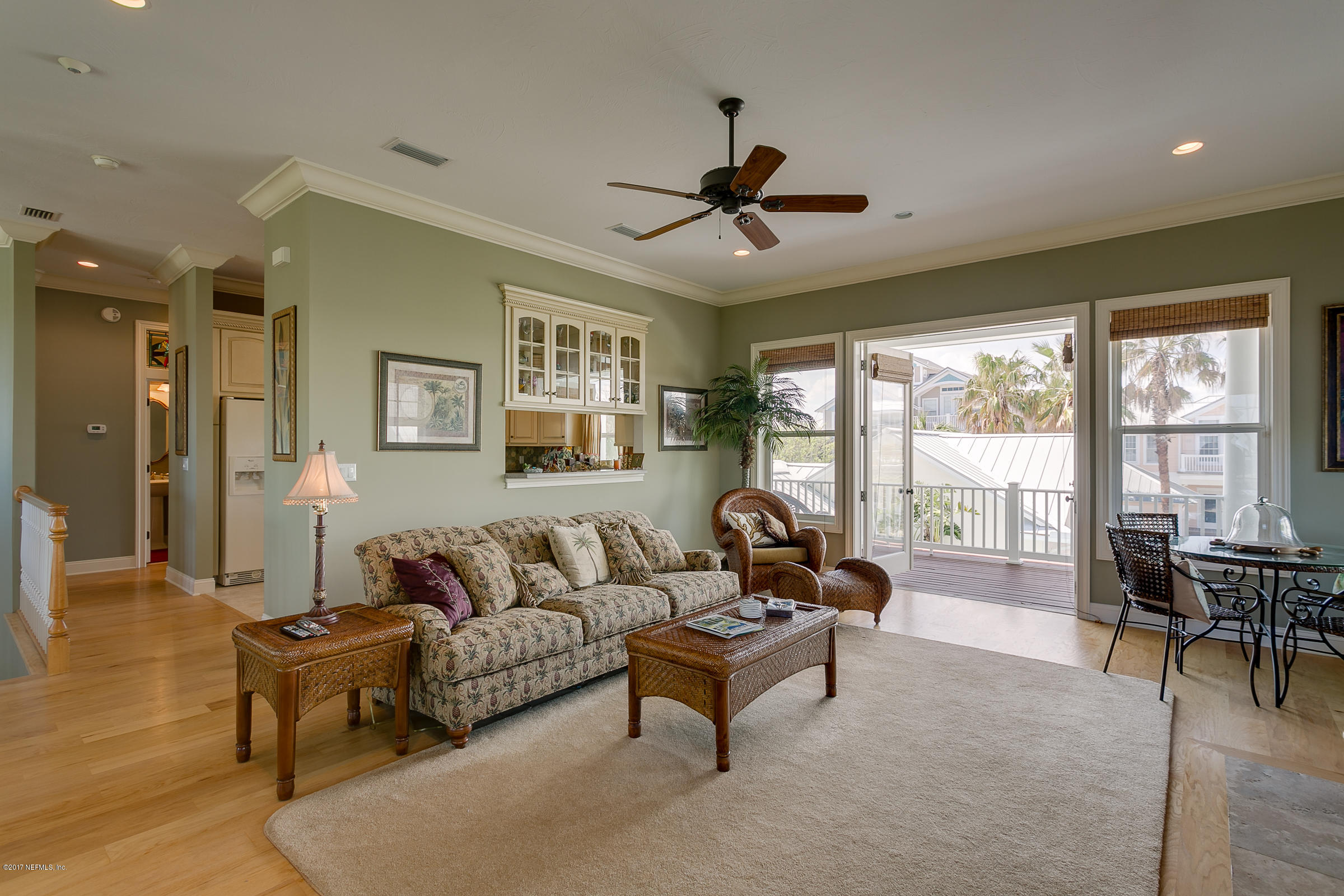 645 Ocean Palm Way St. Augustine, FL 32080 - Photo 23 of 47 a living room with furniture and a large window