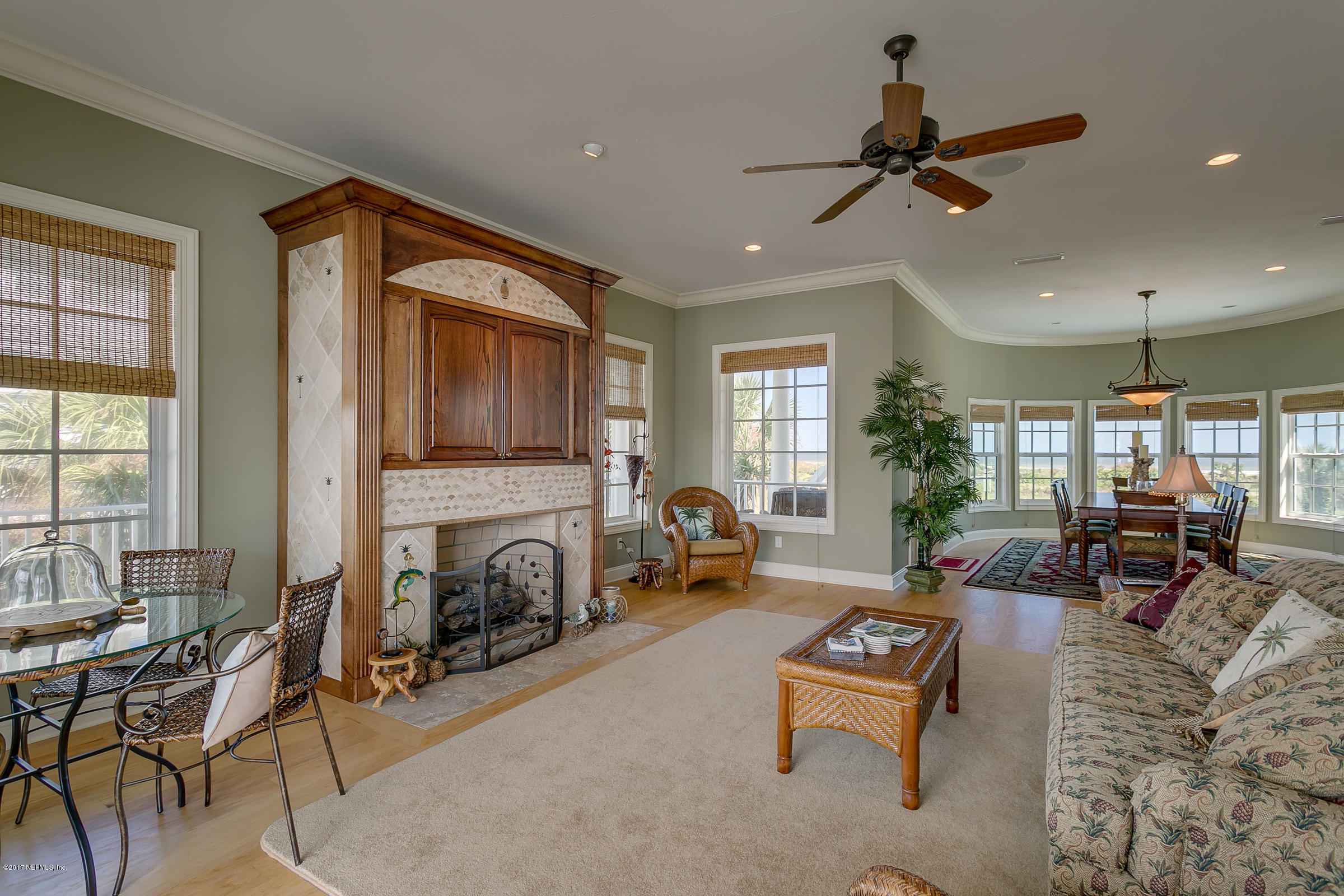 645 Ocean Palm Way St. Augustine, FL 32080 - Photo 24 of 47 a living room with furniture and a fireplace