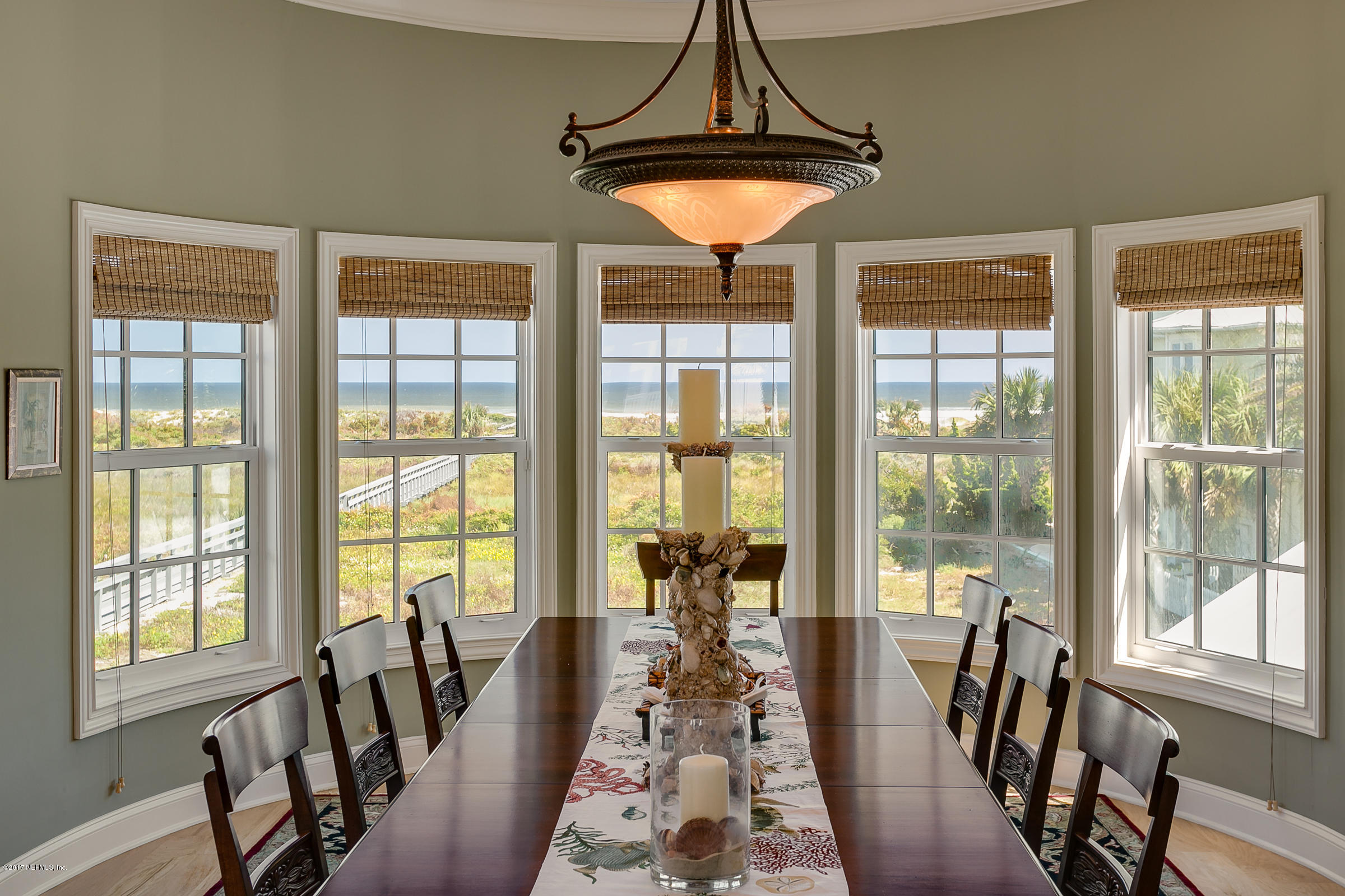 645 Ocean Palm Way St. Augustine, FL 32080 - Photo 29 of 47 a view of a dining room with furniture window and wooden floor