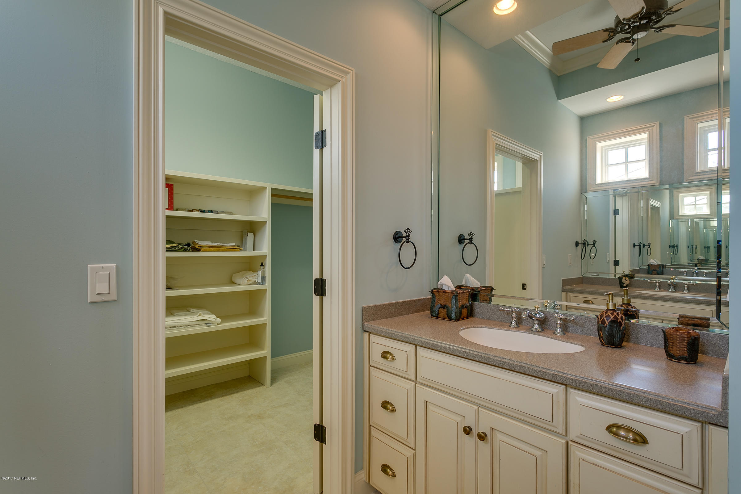 645 Ocean Palm Way St. Augustine, FL 32080 - Photo 34 of 47 a bathroom with a double vanity sink and a mirror