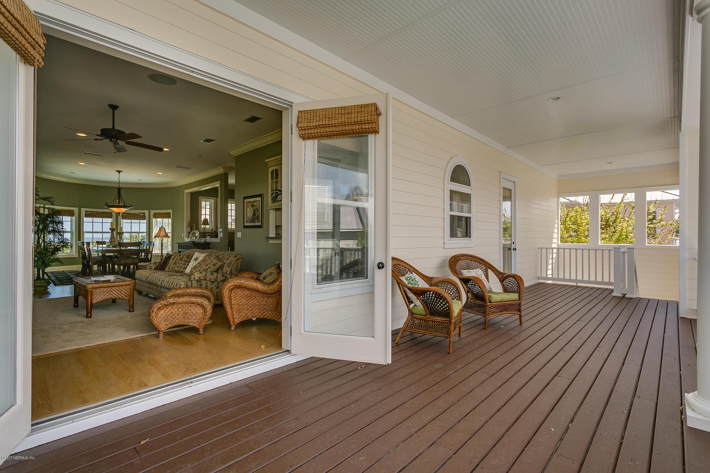 645 Ocean Palm Way St. Augustine, FL 32080 - Photo 37 of 47 a living room with furniture a wooden floor and a window