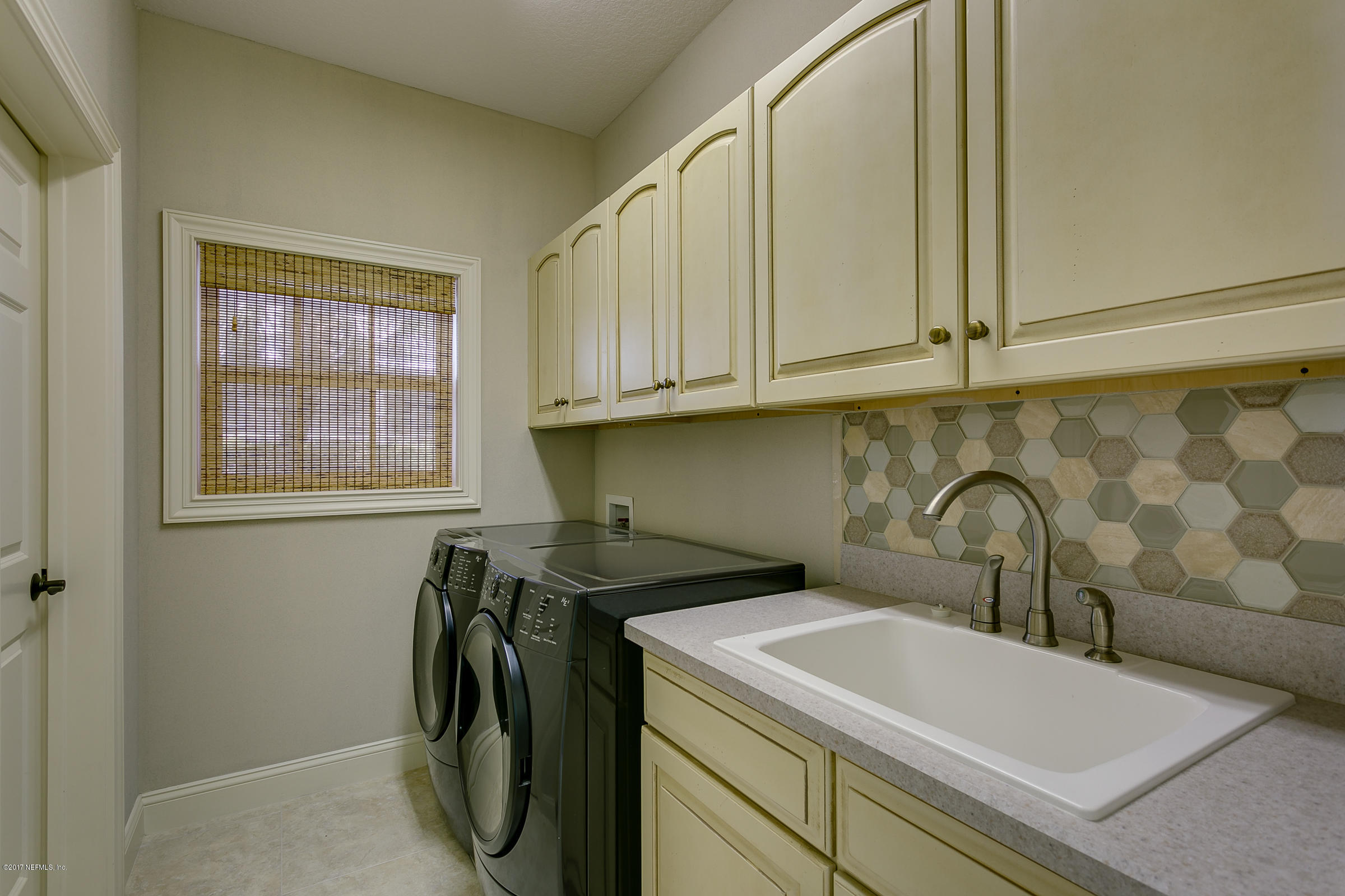 645 Ocean Palm Way St. Augustine, FL 32080 - Photo 38 of 47 a view of a sink and dishwasher in a bathroom