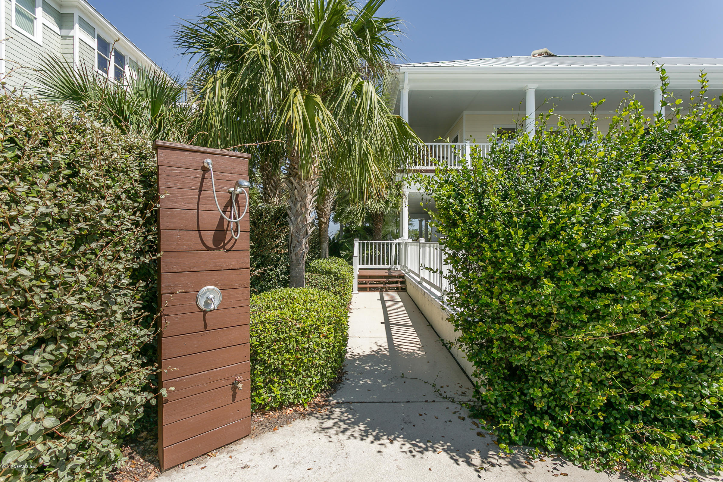 645 Ocean Palm Way St. Augustine, FL 32080 - Photo 39 of 47 a front view of a house with a yard and a garage