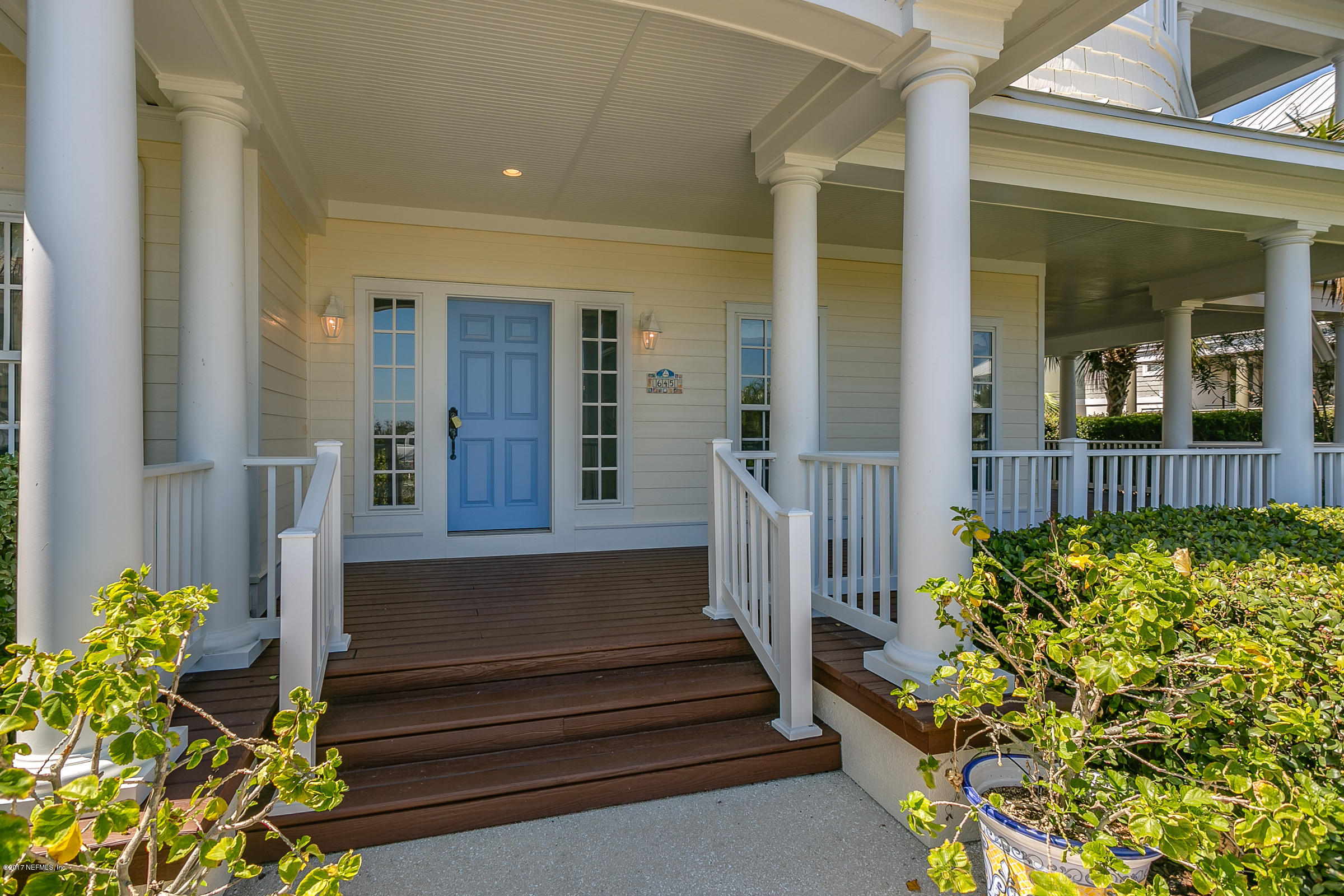 645 Ocean Palm Way St. Augustine, FL 32080 - Photo 4 of 47 a front view of a house with a garden