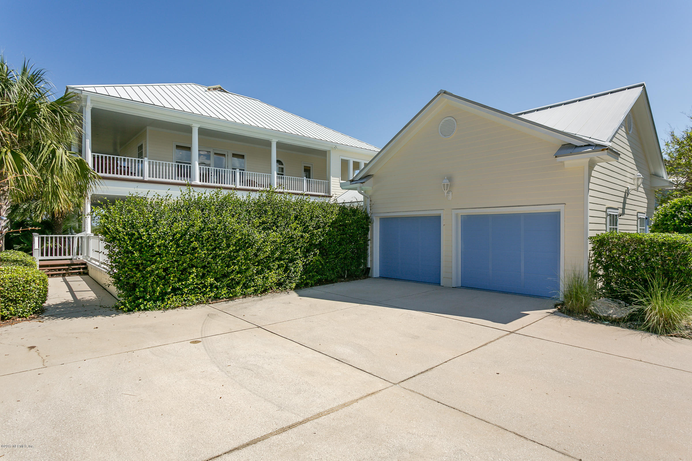 645 Ocean Palm Way St. Augustine, FL 32080 - Photo 41 of 47 a front view of house with yard and trees around