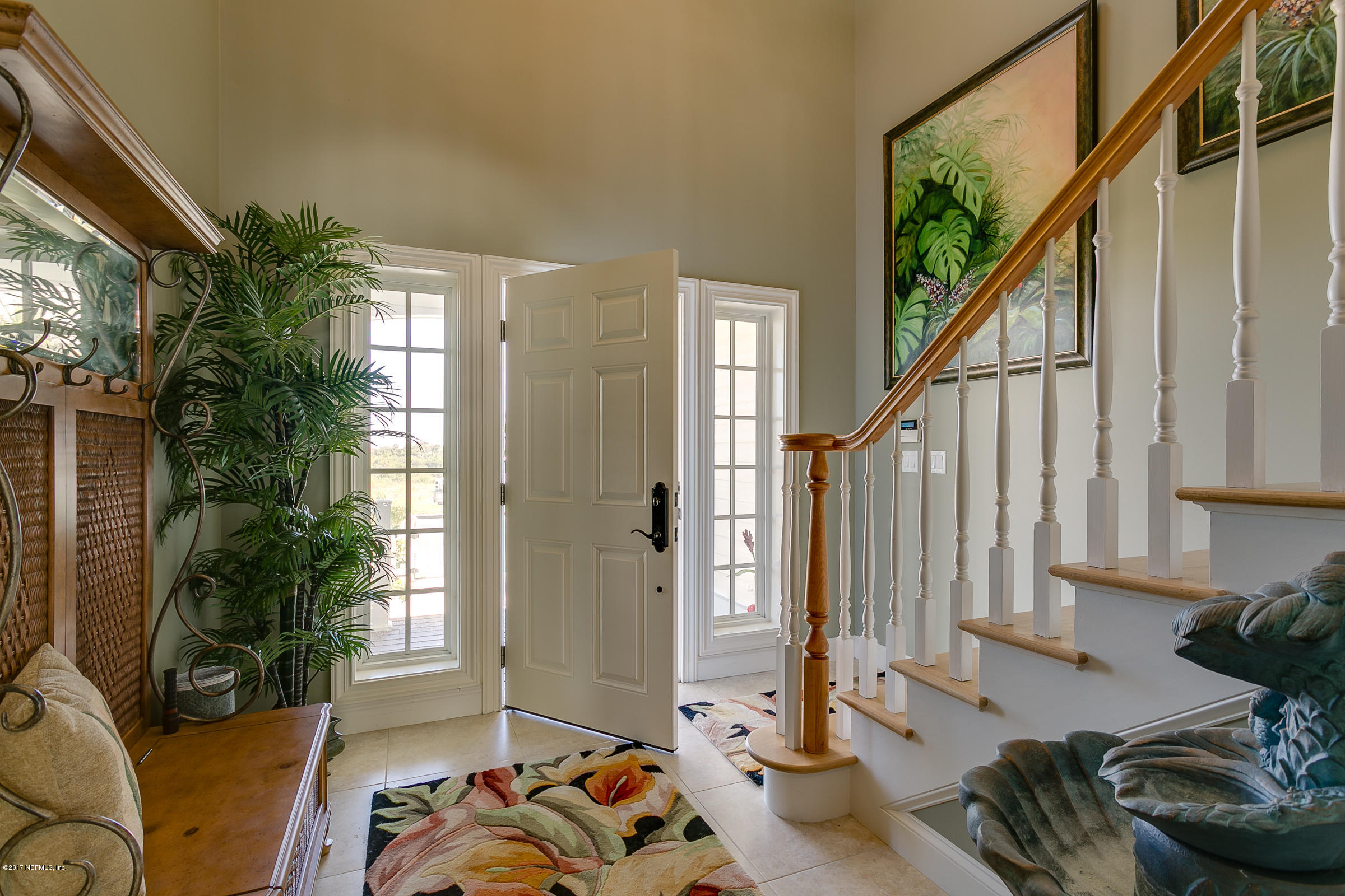 645 Ocean Palm Way St. Augustine, FL 32080 - Photo 6 of 47 a living room with furniture and a potted plant
