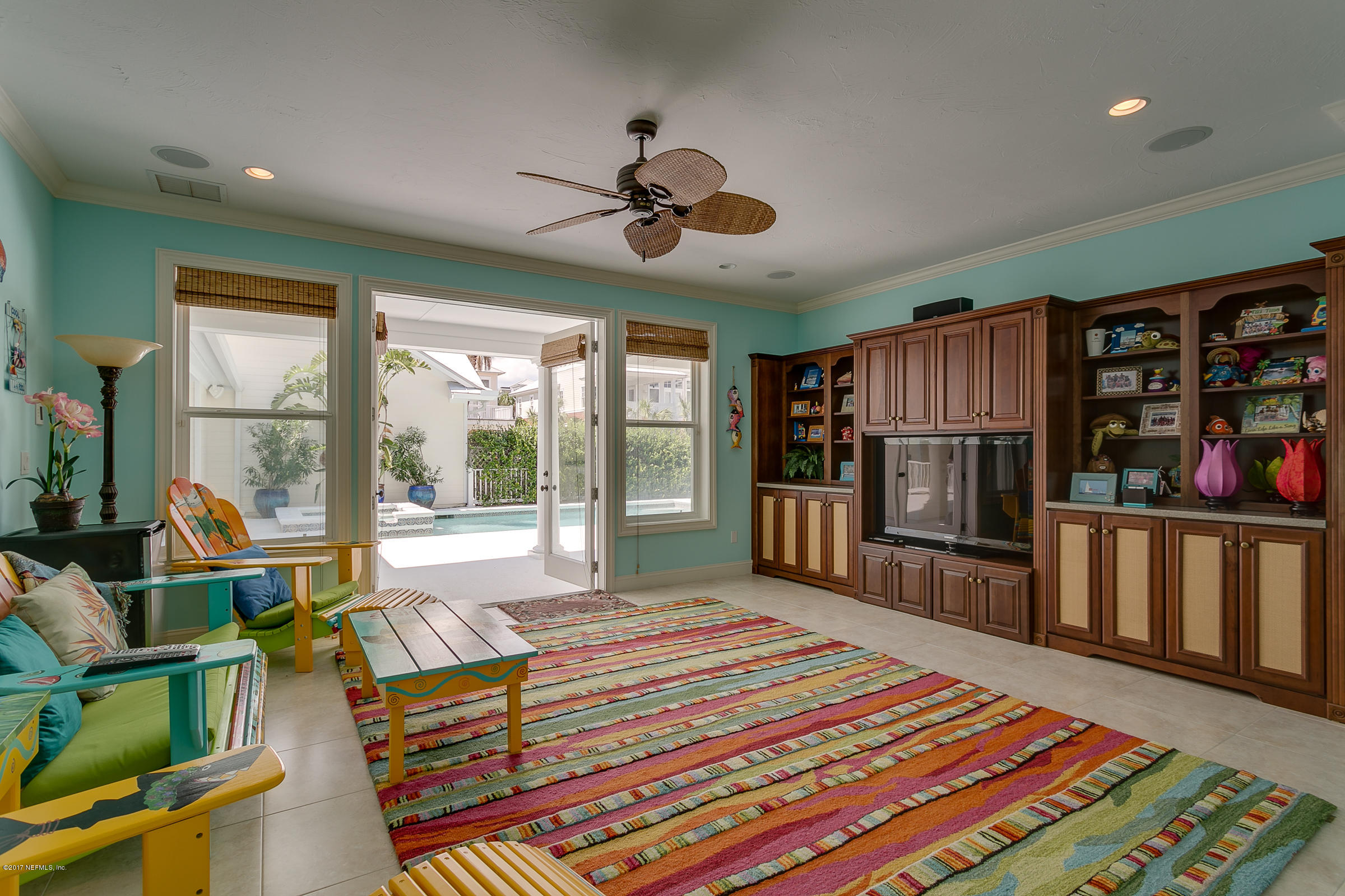 645 Ocean Palm Way St. Augustine, FL 32080 - Photo 7 of 47 a bedroom with furniture and a book shelf