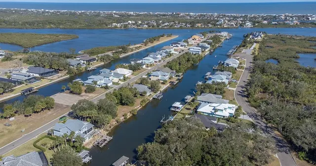 an aerial view of a city with a lake