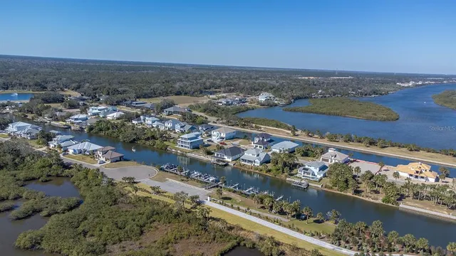 an aerial view of residential building and ocean