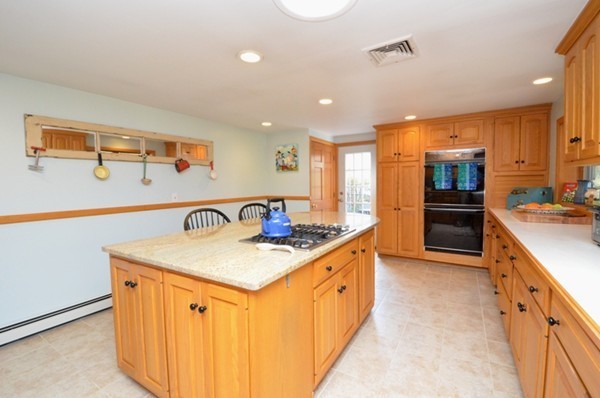 140 Prescott Road Northbridge, MA 01588 - Photo 4 of 22 a kitchen with stainless steel appliances granite countertop a sink a stove and a refrigerator