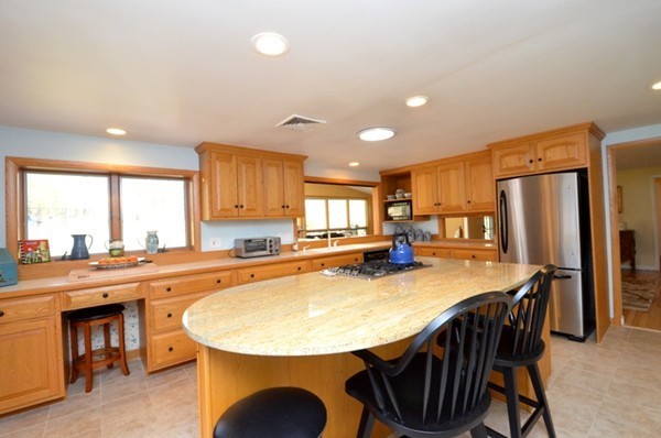 140 Prescott Road Northbridge, MA 01588 - Photo 5 of 22 a kitchen with stainless steel appliances granite countertop a kitchen island a stove a table and chairs