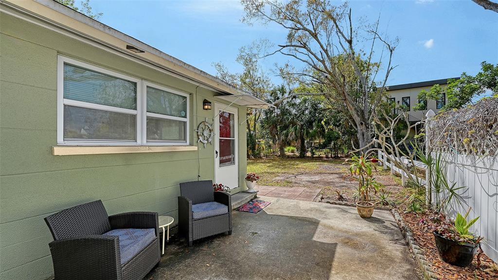 1860 7th Street Sarasota, FL 34236 - Photo 16 of 75 a backyard of a house with outdoor seating